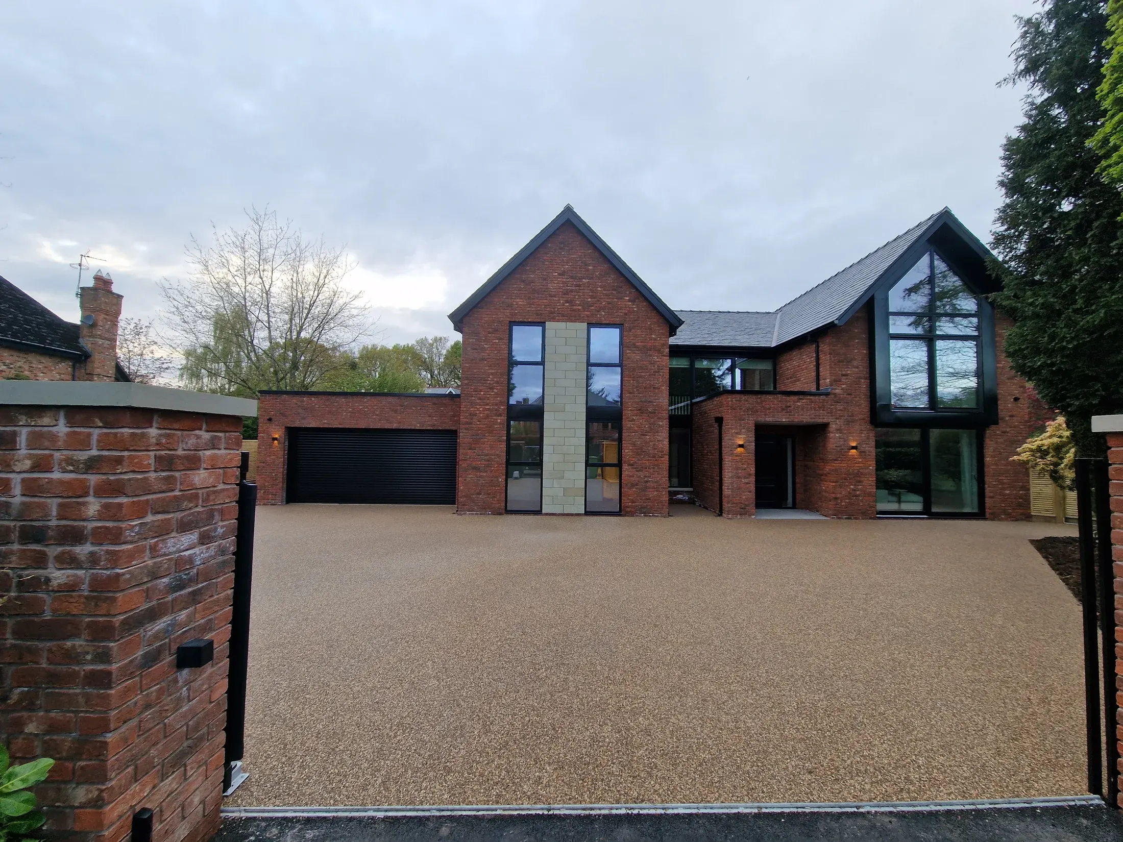 Finished warm resin bound driveway outside a contemporary Cheshire home