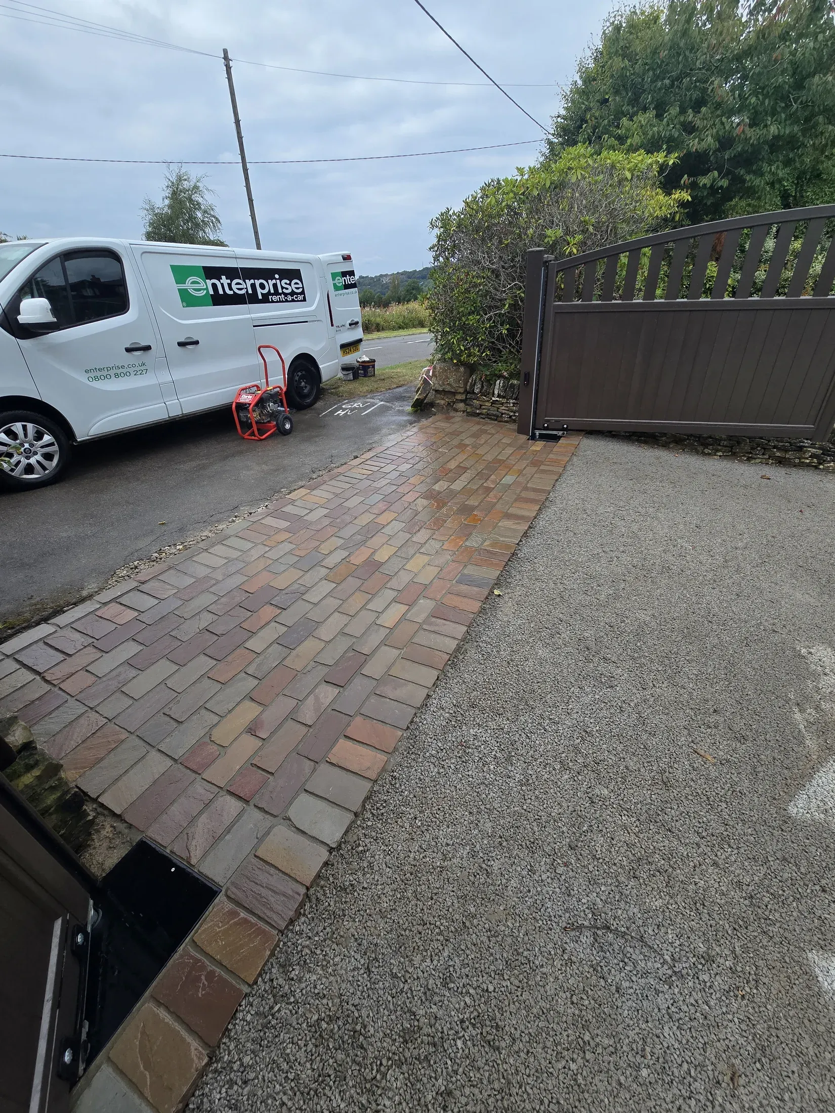 Existing mixed driveway surfaces being assessed before resurfacing