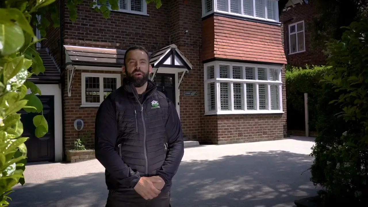 Ian from Cheshire Design standing on a completed resin driveway